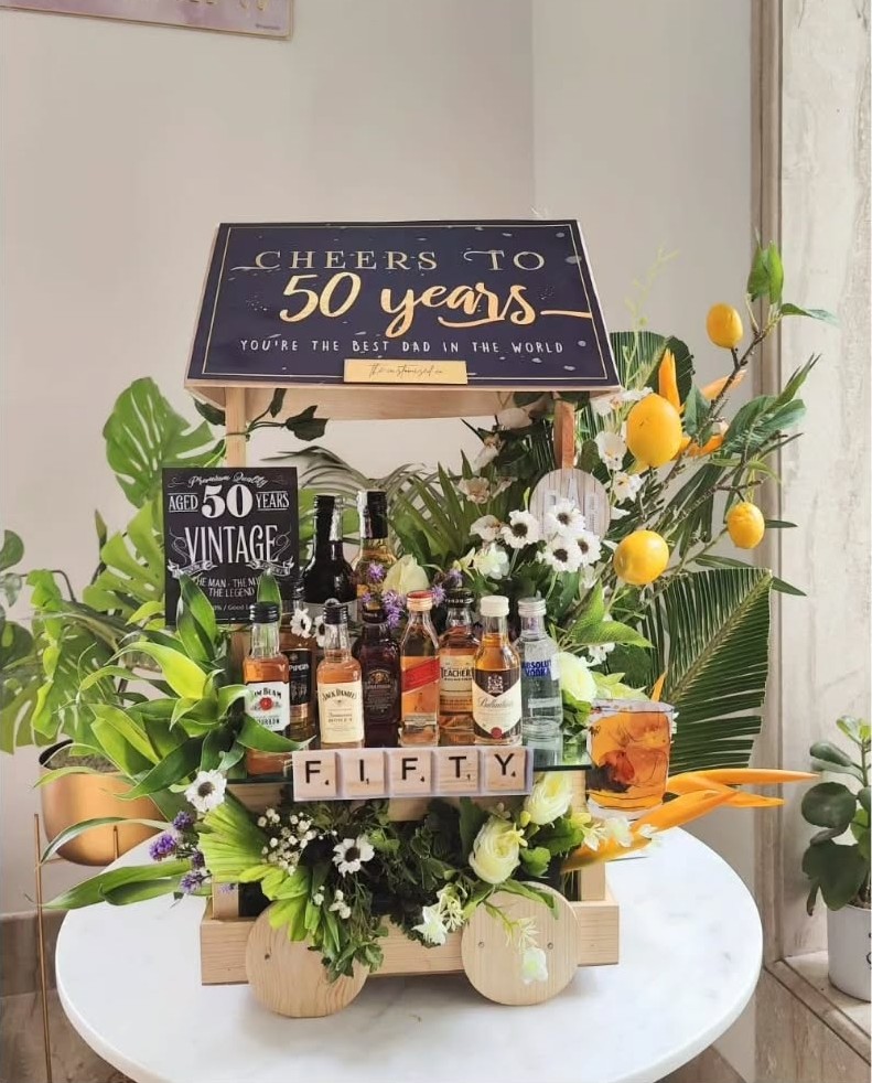 Bespoke 50th birthday celebration hamper with curated luxury gifts and elegant presentation